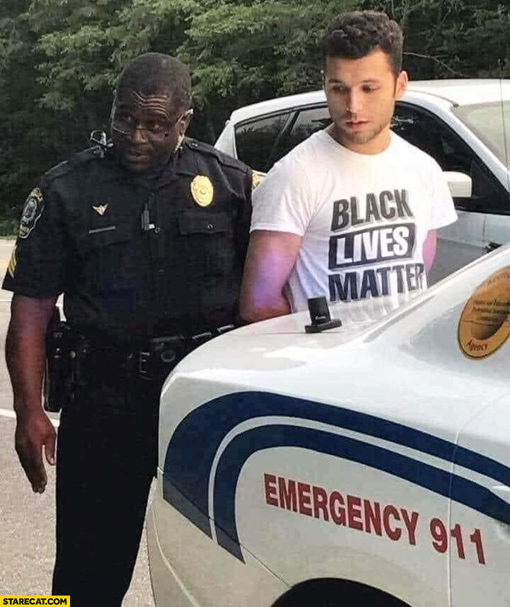 Black policeman arresting white man wearing black lives matter shirt
