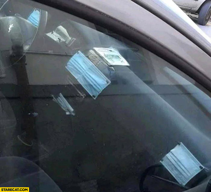 Car dash vents covered with face masks anti covid setup corona virus