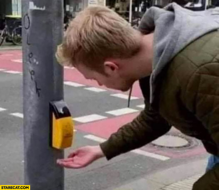 Man using pedestrian walk button like soap dispenser fail