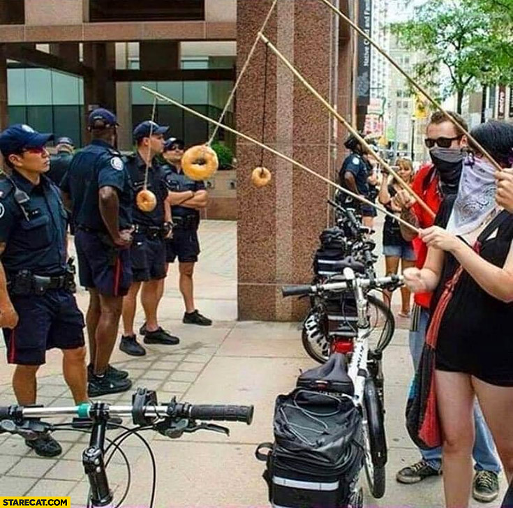 Protesters feed police with donuts on fishing rods trolling