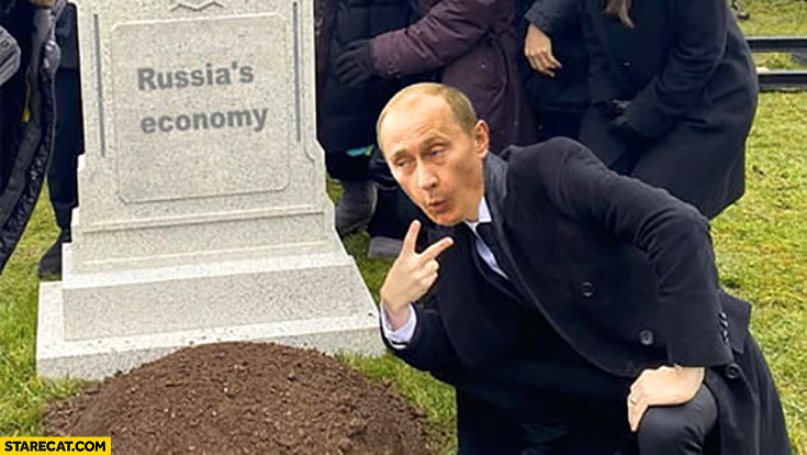 Putin next to Russia’s economy grave celebrating