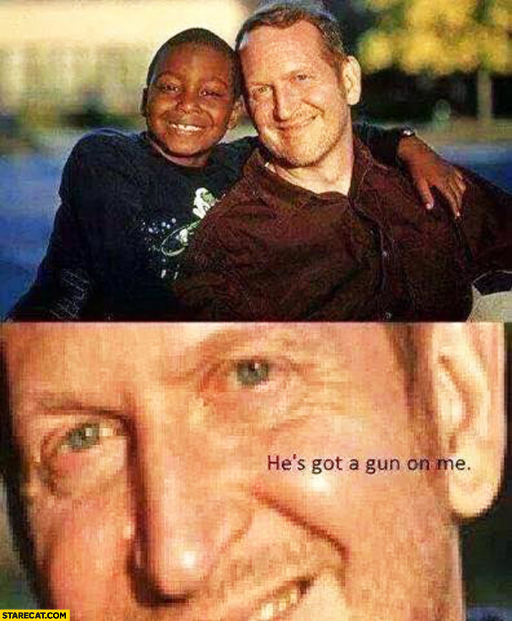 Smiling man black kid he’s got a gun on me